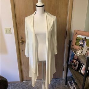 1X cream open cardigan. Sheer in back.